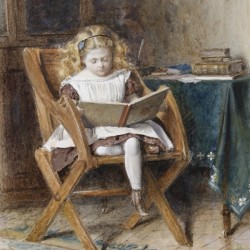 A young girl reading